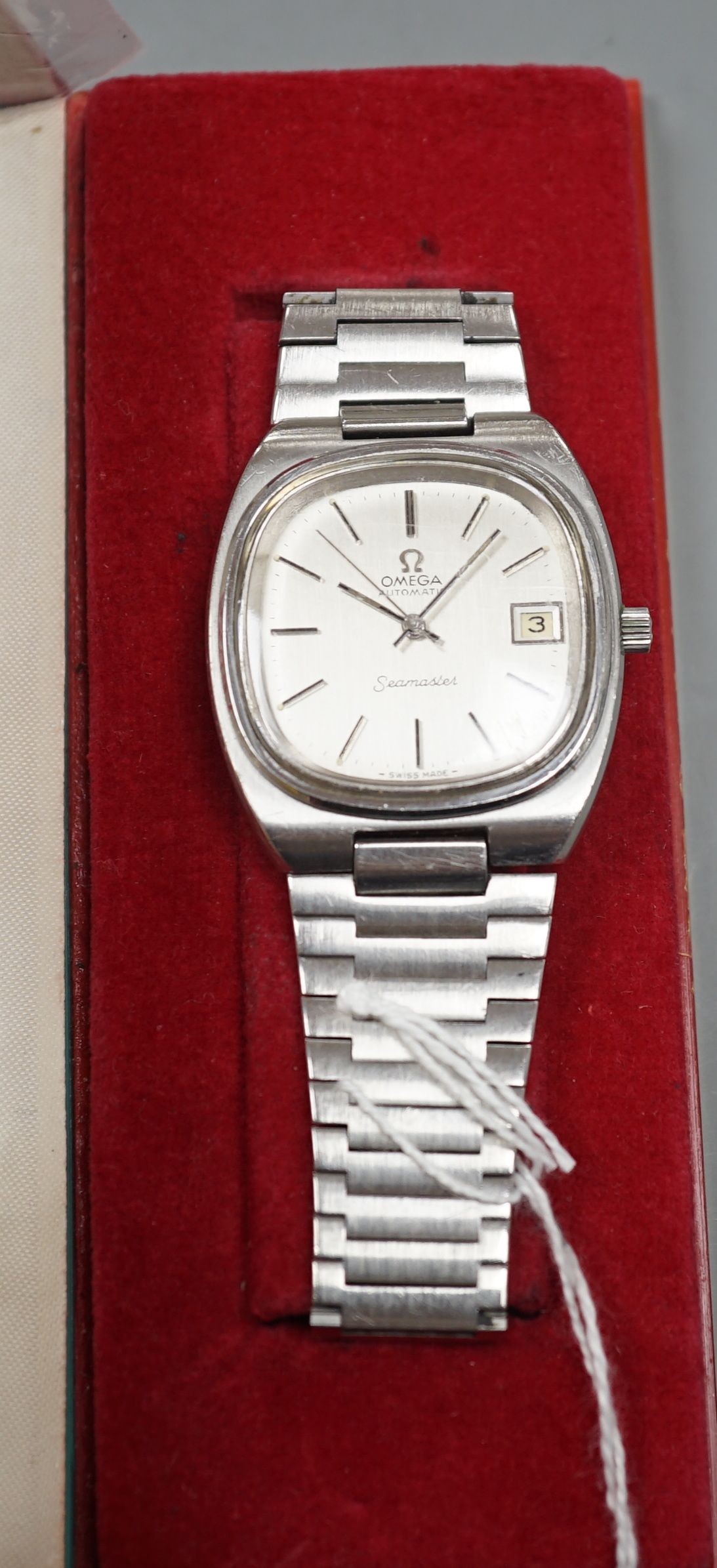 A gentleman's 1970's stainless steel Omega Seamaster automatic wrist watch, on a stainless steel Omega bracelet, with box, spare link, spare glass and original guarantee, case diameter 36mm.